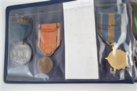 Lot 303 - Album of mixed late 19th early 20th century medals and two others.