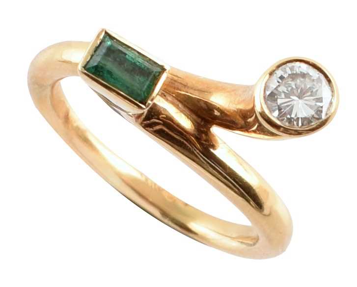 Lot 73 - Diamond and emerald two stone modern design 18ct gold ring