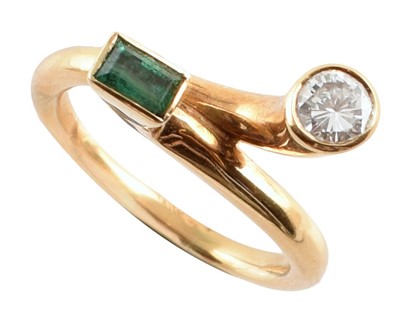 Lot 73 - Diamond and emerald two stone modern design 18ct gold ring