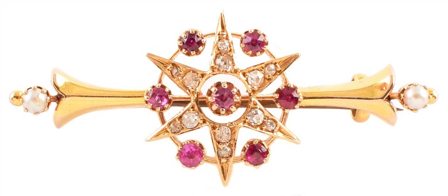 Lot 35 - Victorian/Edwardian ruby and diamond star burst cluster 15ct gold bar brooch