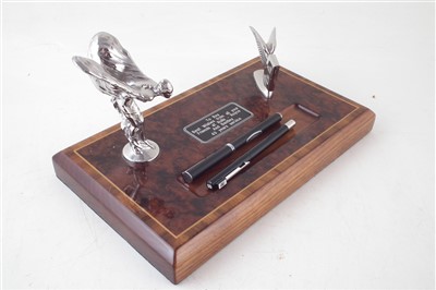 Lot 215 - Desk stand with Rolls Royce and winged Bentley mascot on walnut base with two pens.