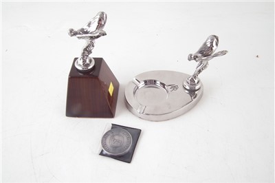 Lot 216 - Rolls Royce ashtray with Flying Lady and one other miniature Flying Lady on walnut plinth, also token or coin celebrating 64 years at Crewe.