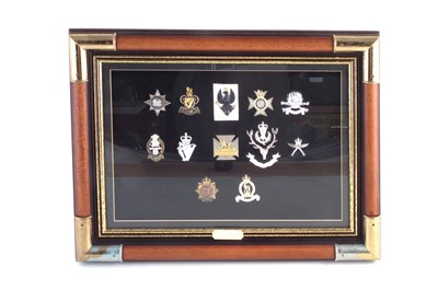 Lot 202 - Ninety two British Army and Police cap badges in three framed sets.