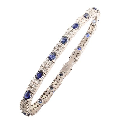 Lot 28 - Sapphire and diamond two-row 18ct white gold line bracelet