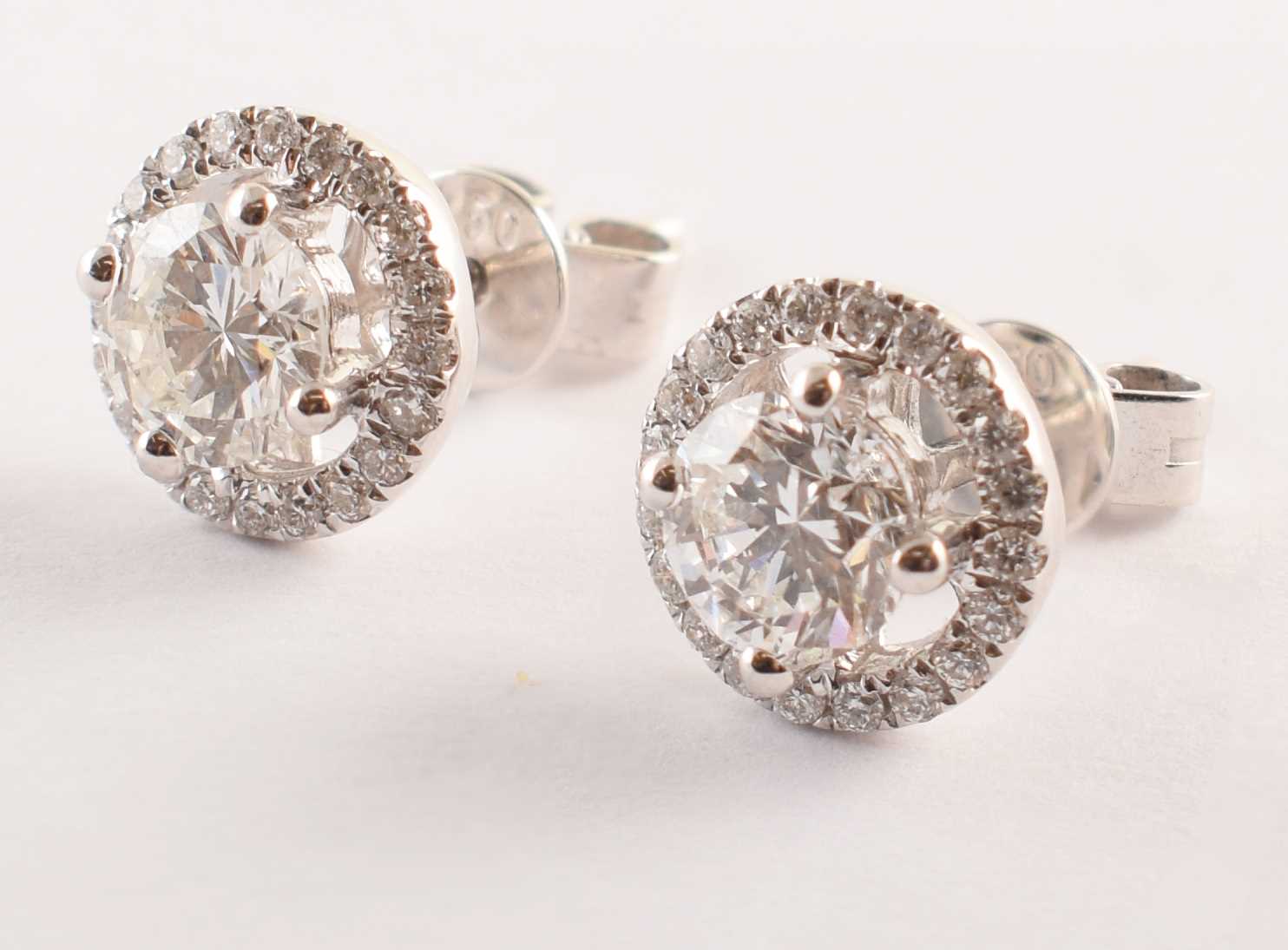 Lot 42 - Pair of diamond 18ct white gold stud earrings