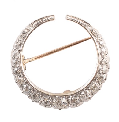 Lot 38 - Diamond and 18ct white gold crescent brooch
