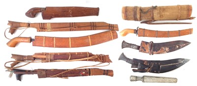 Lot 169 - Five Parangs and scabbards