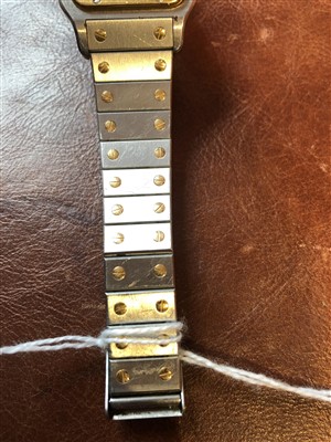 Lot 137 - Gent's Cartier Santos steel and yellow gold bracelet watch.
