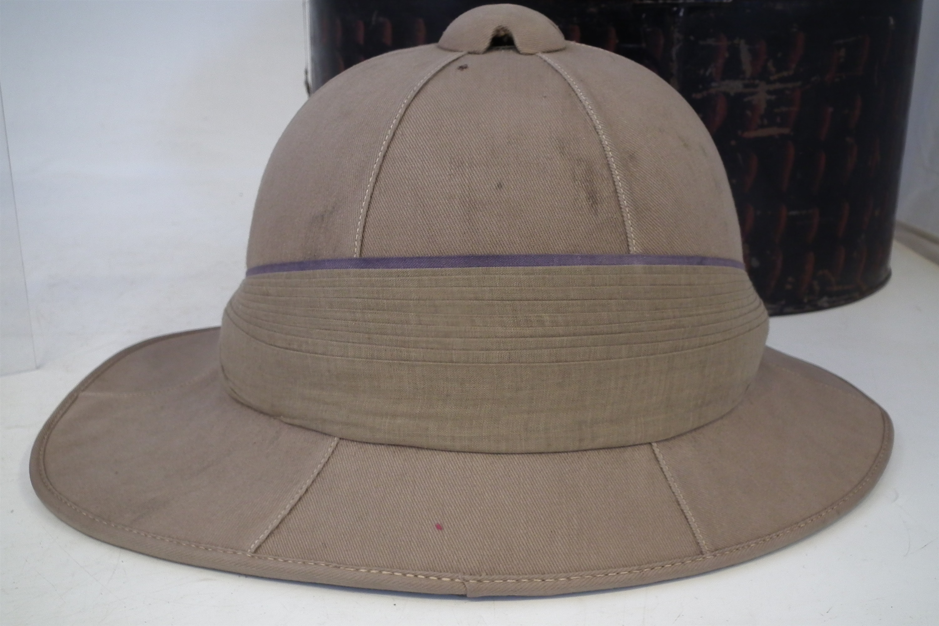 Lot 219 - Two Pith helmets, one with tin case, Boer