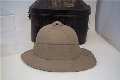 Lot 219 - Two Pith helmets, one with tin case, Boer war era