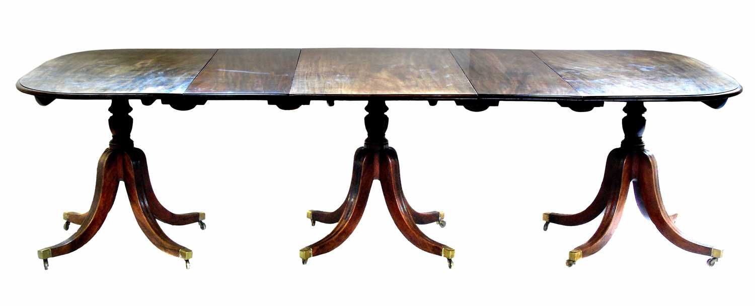 518 - George III mahogany three-pillar dining table.