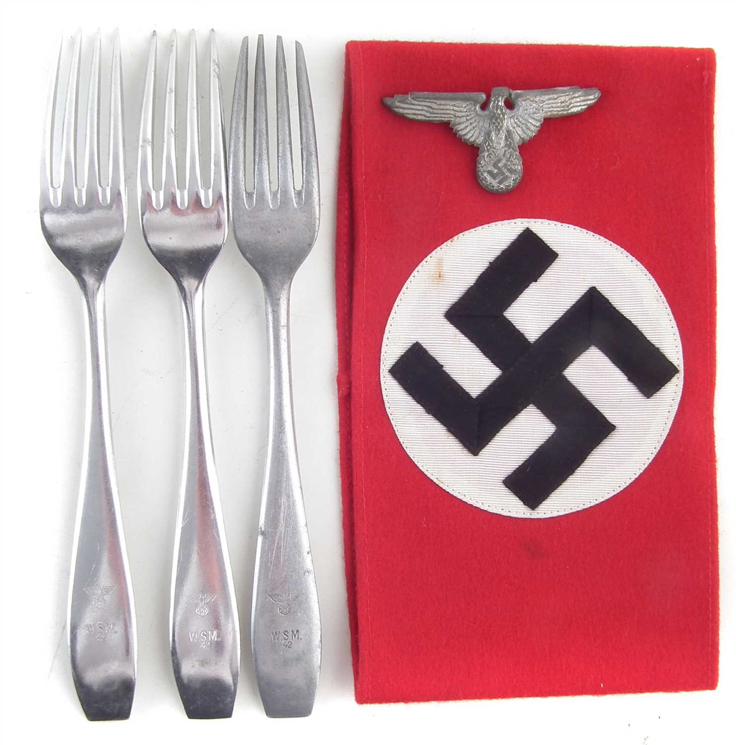 Lot 325 - Three German WWII Third Reich forks, a eagle badge and an arm band