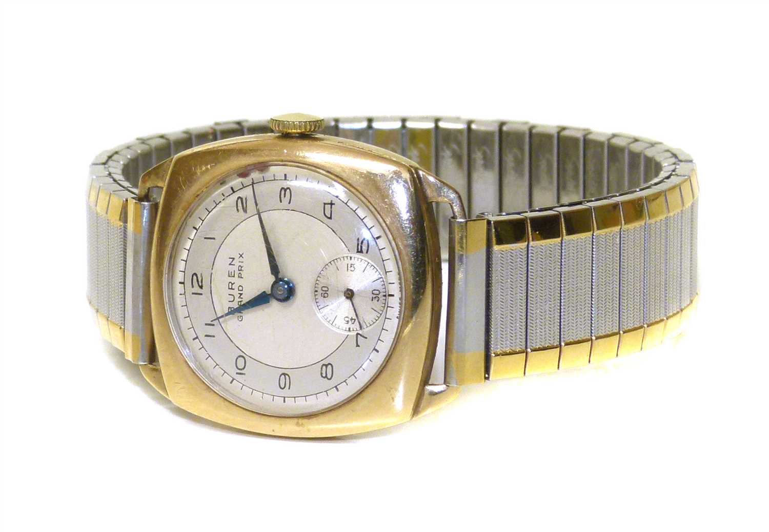 407 - A 1950's 9ct gold Buren Grand Prix manual wind wristwatch,