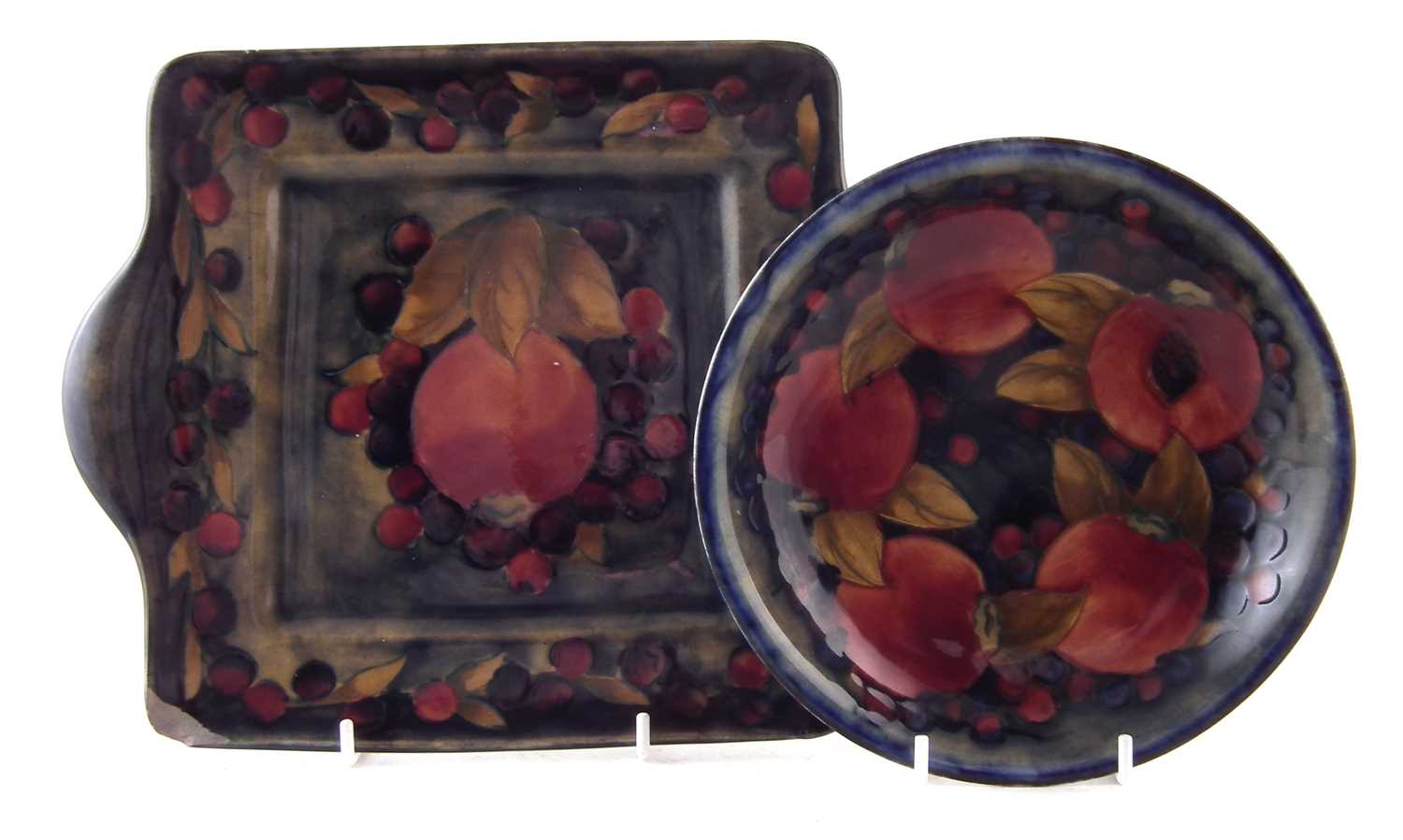 Lot 239 - Moorcroft dish and two handled bread and butter plate, pomegranate pattern.
