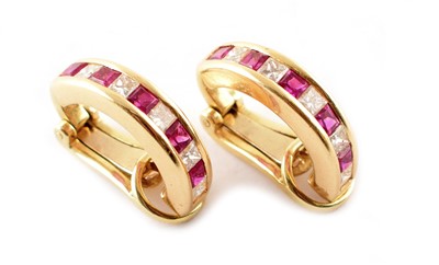 Lot 93 - A pair of ruby and diamond set 18ct yellow gold half hoop clip earrings.