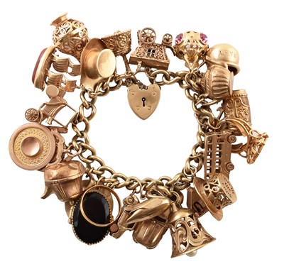 Lot 75 - 9ct gold charm bracelet containing 24 assorted gold charms.
