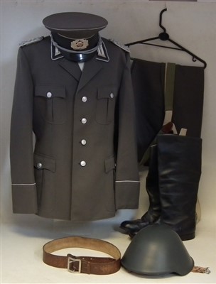 Lot 205 - East German Infantry tunic, trousers, belt, cap, helmet and a pair of Russian made boots.