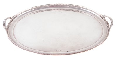 Lot 57 - An early 20th Century large silver twin handled tray