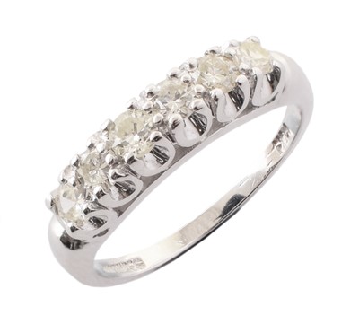 Lot 119 - A diamond six stone 14ct white gold band ring