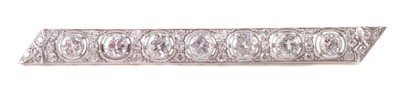 Lot 81 - A diamond set platinum bar brooch.