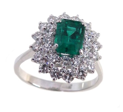 Lot 116 - Emerald and diamond 3-tier oval cluster platinum ring.
