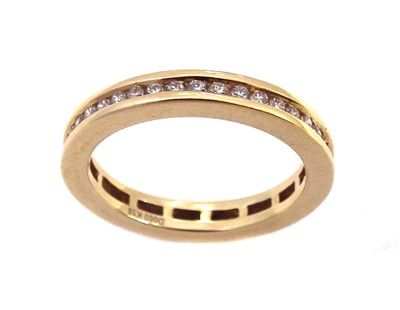 Lot 117 - A diamond full eternity 18ct yellow gold ring.