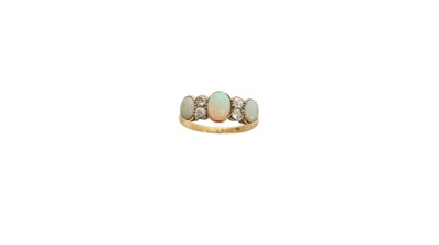 Lot 218 - An opal and diamond dress ring