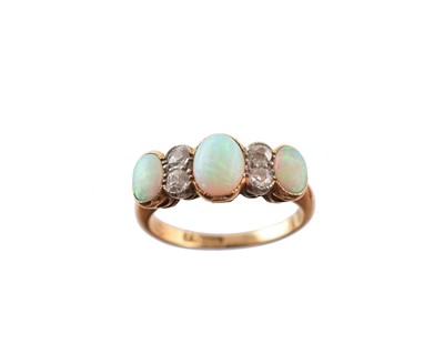 Lot 218 - An opal and diamond dress ring