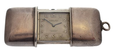 Lot 306 - A 1920's silver Movado Ermeto travel clock