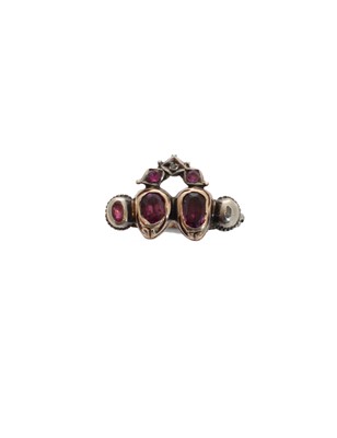 Lot 189 - A foil back ruby and diamond dress ring