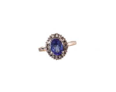Lot 225 - An 18ct gold tanzanite and diamond cluster ring
