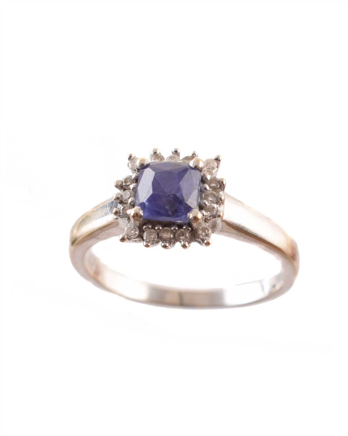 Lot 222 - A tanzanite and diamond cluster ring