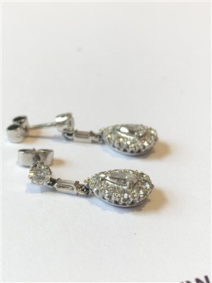 Lot 104 - A pair of diamond drop earrings