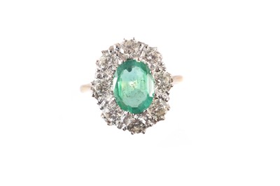 Lot 215 - An emerald and diamond cluster ring