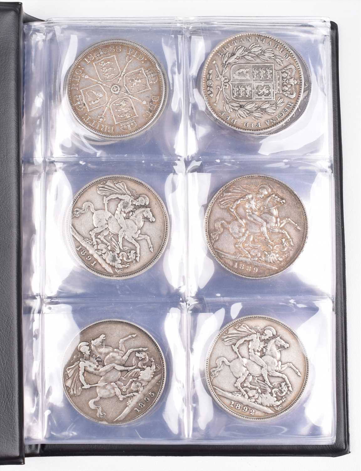 Lot 89 - Black album of various silver crowns together with a selection of various halfcrowns and others.