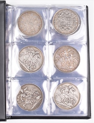 Lot 89 - Black album of various silver crowns together with a selection of various halfcrowns and others.
