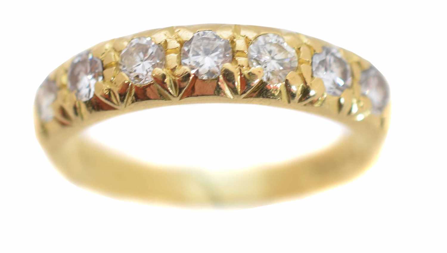 Lot 197 - An 18ct gold diamond band ring