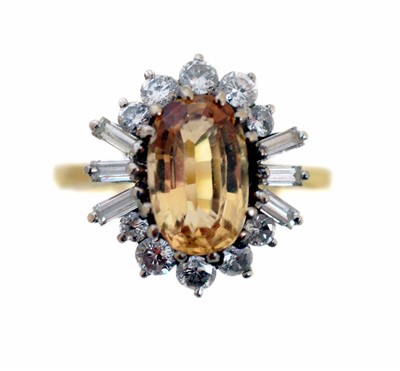 Lot 220 - A topaz and diamond cluster ring