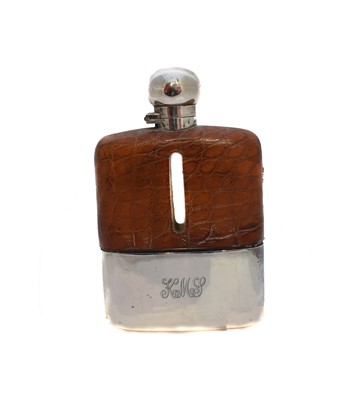 Lot 35 - A 1930's silver and leather cased hip flask
