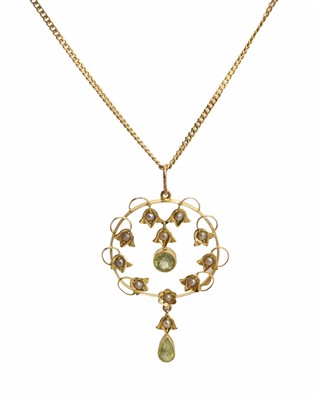 Lot 178 - An early 20th century peridot and split pearl pendant