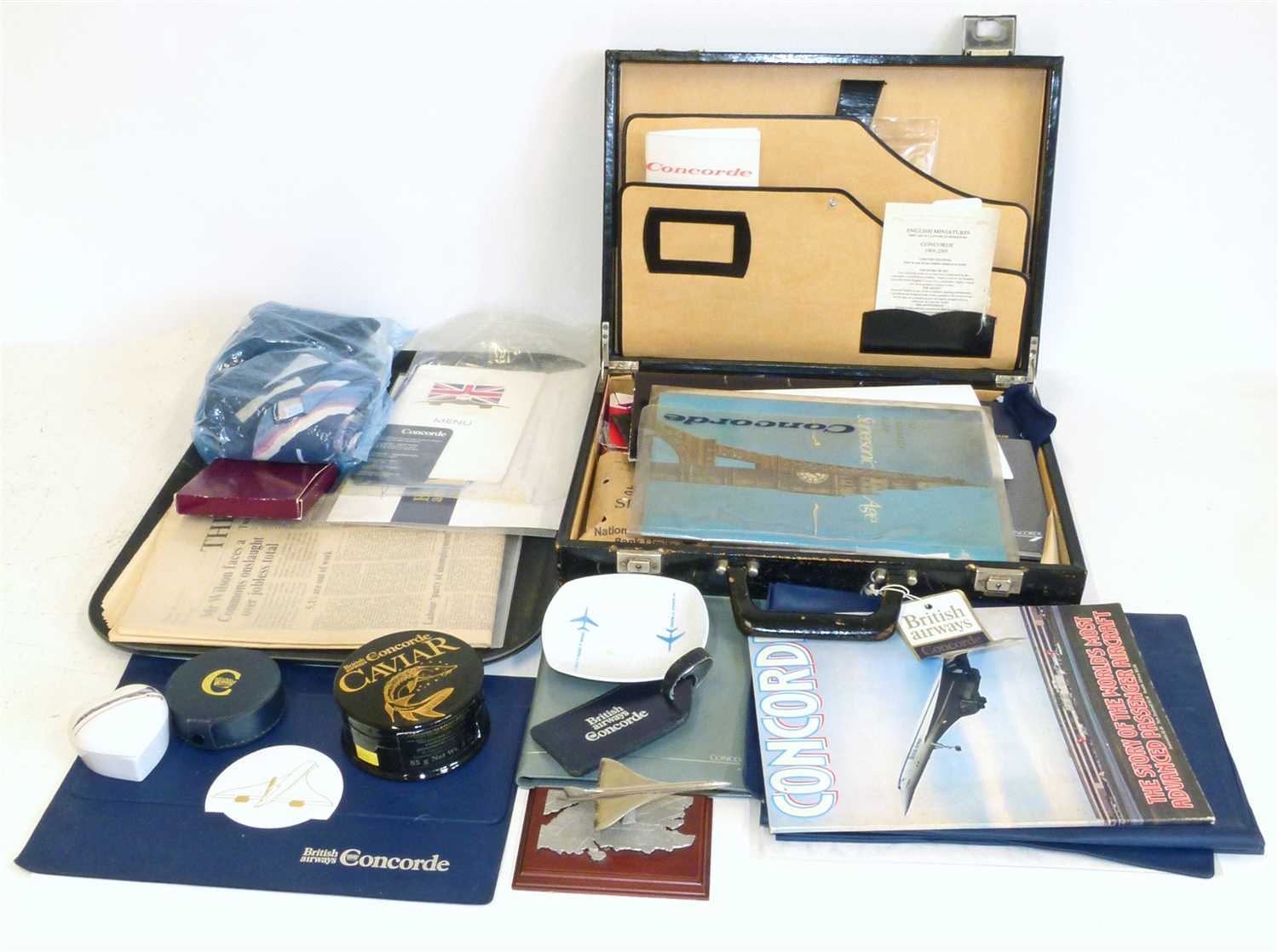 Lot 146 - A collection of Concorde items including menu, place mats, certificates, magazines, ties and heart shaped box etc