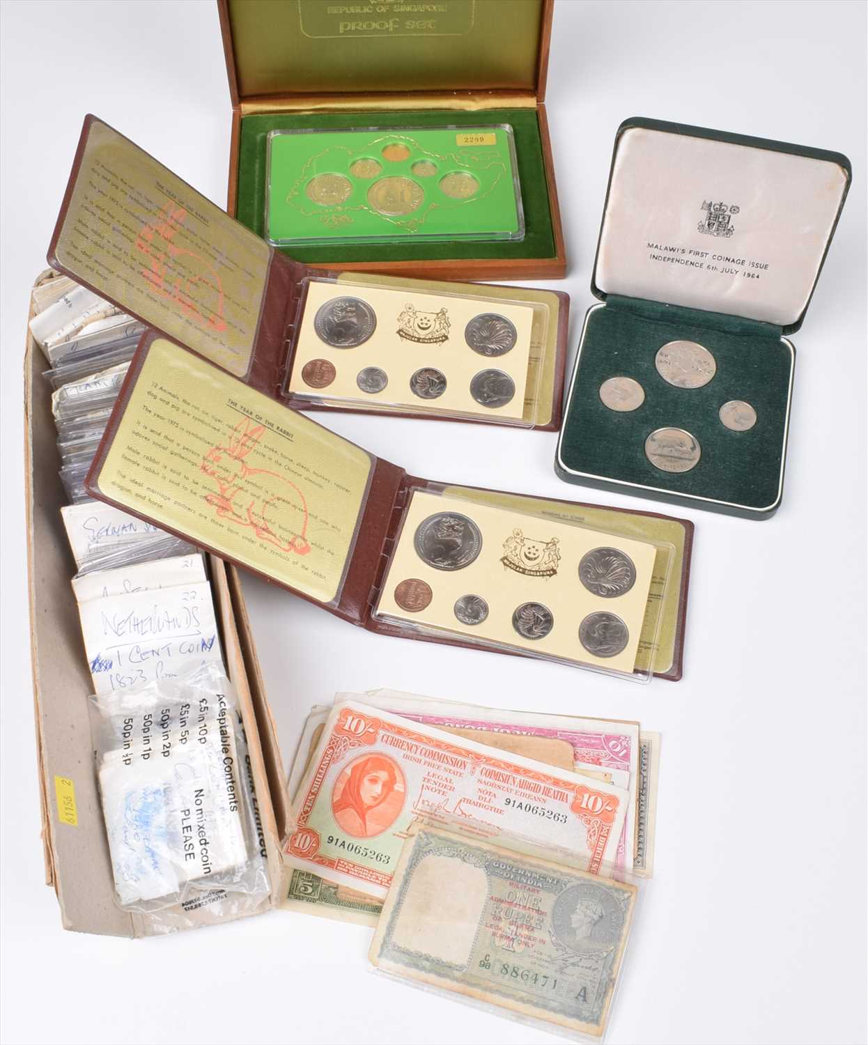 Lot 4 - Album of various foreign coins together with an assortment of foreign banknotes.
