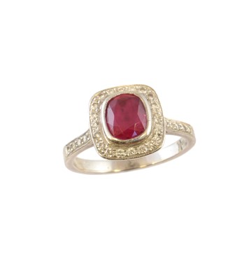 Lot 206 - A platinum ruby and diamond cluster ring