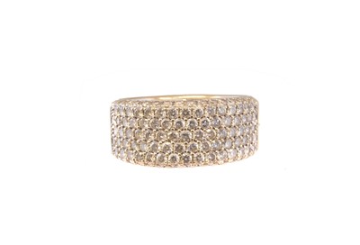 Lot 183 - An 18ct gold diamond band ring
