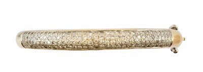 Lot 73 - An 18ct gold diamond hinged bangle