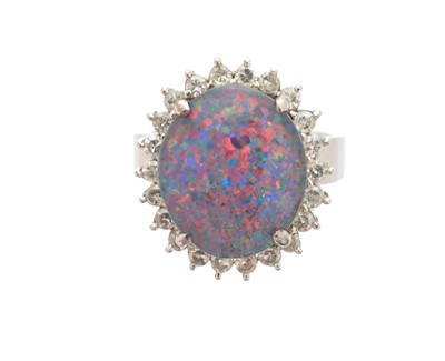 Lot 232 - A synthetic opal triplet and diamond cluster ring