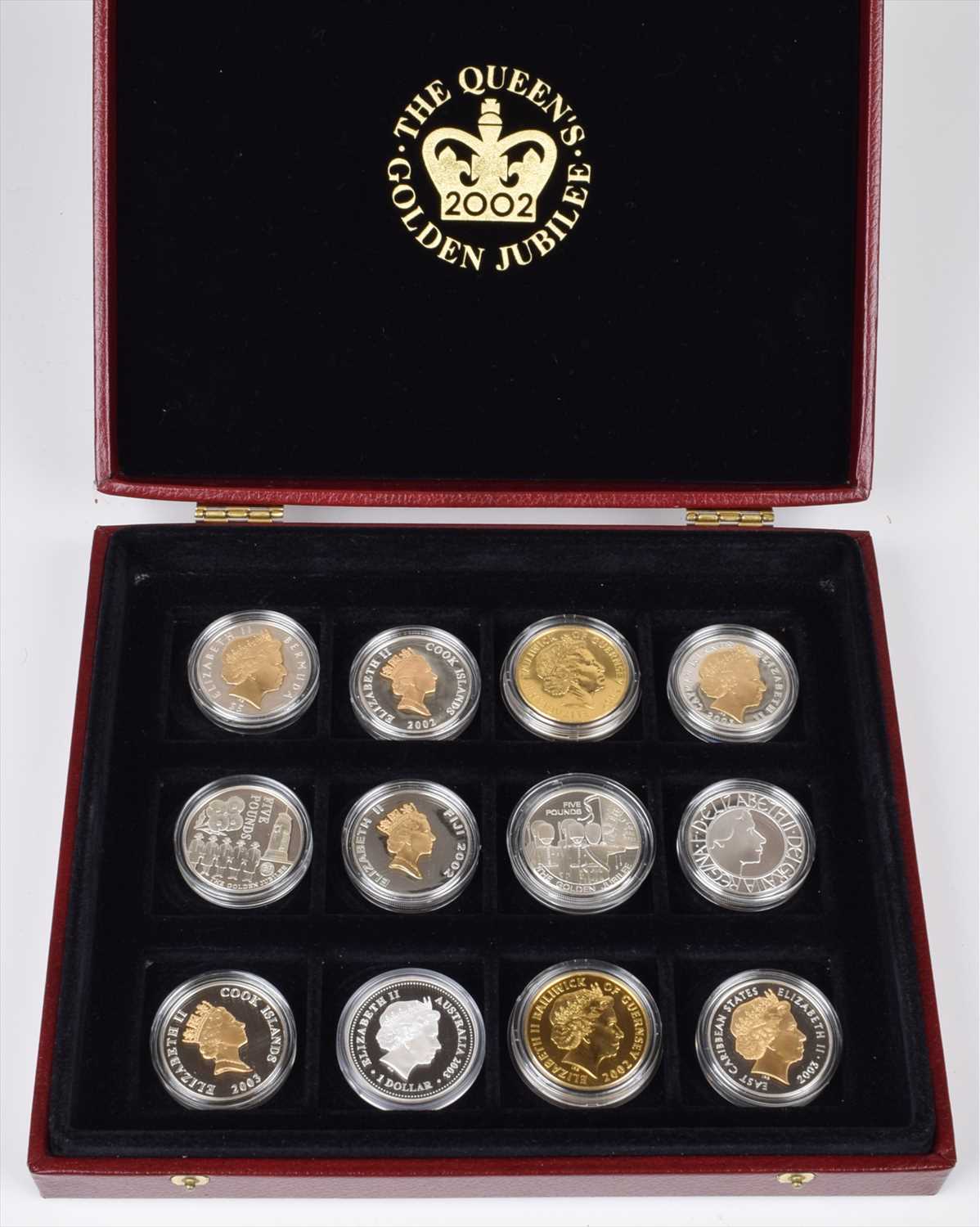 Lot 15 - Box containing Five Pounds and Dollar coins relating to the Queen's Golden Jubilee 2002.