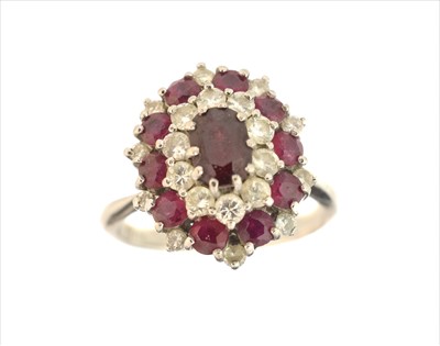 Lot 207 - A ruby and diamond cluster ring