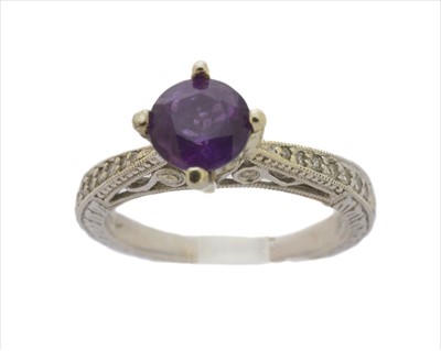 Lot 211 - An amethyst and diamond dress ring