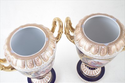 Lot 137 - A pair of Dresden twin handled lidded vases